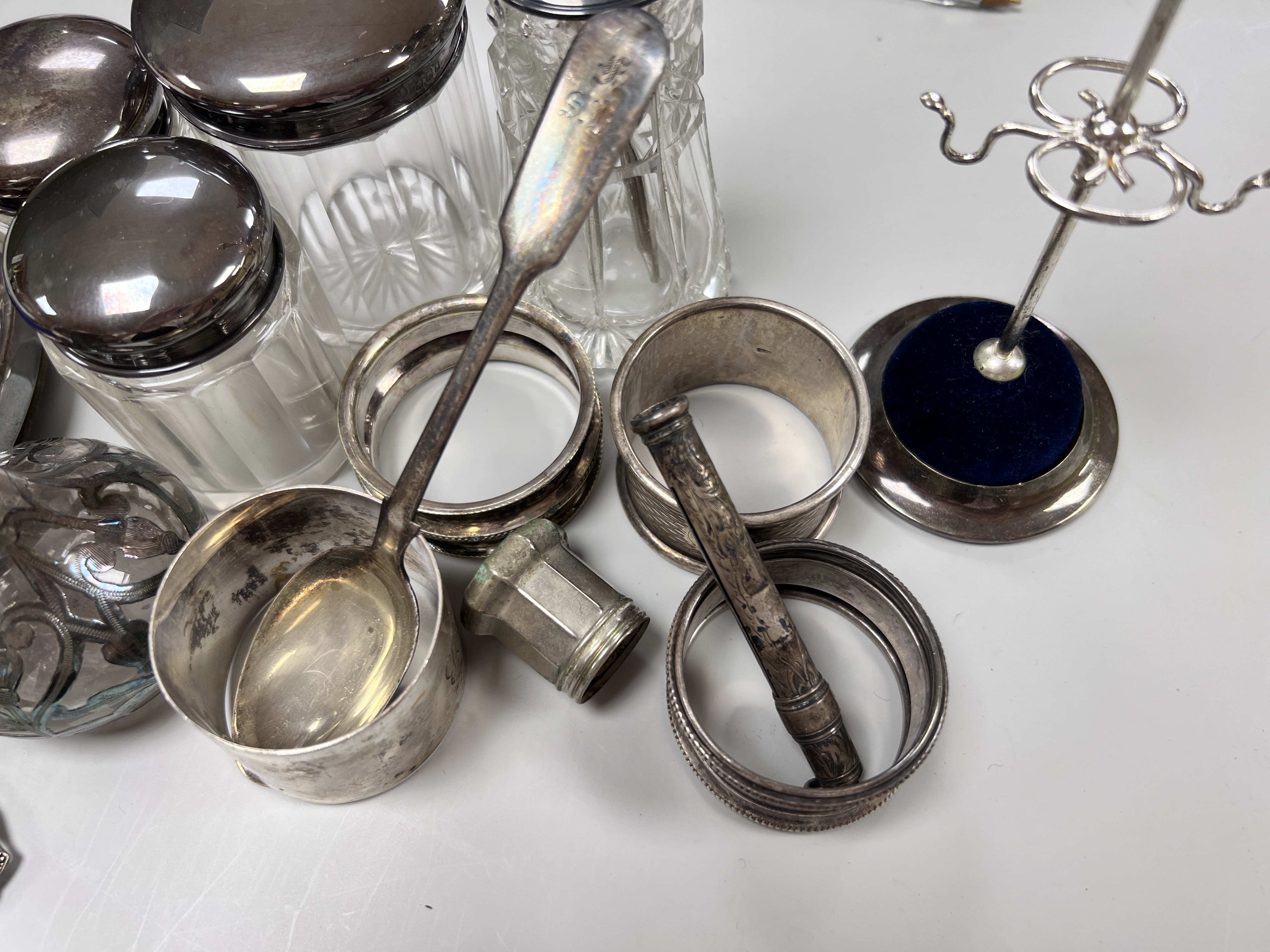 Sundry small silver including circular photograph frame, toilet jars, napkin ring ring tree etc.